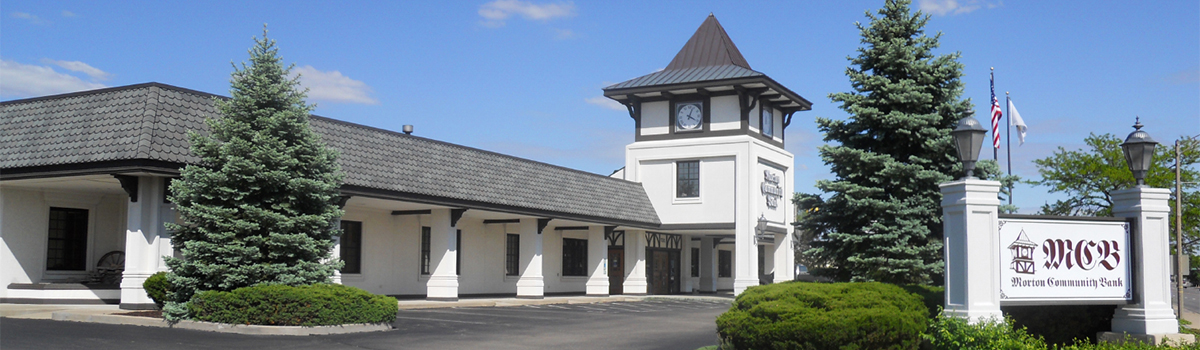 A large white building with a clock tower - Morton Community Bank - Morton Illinois