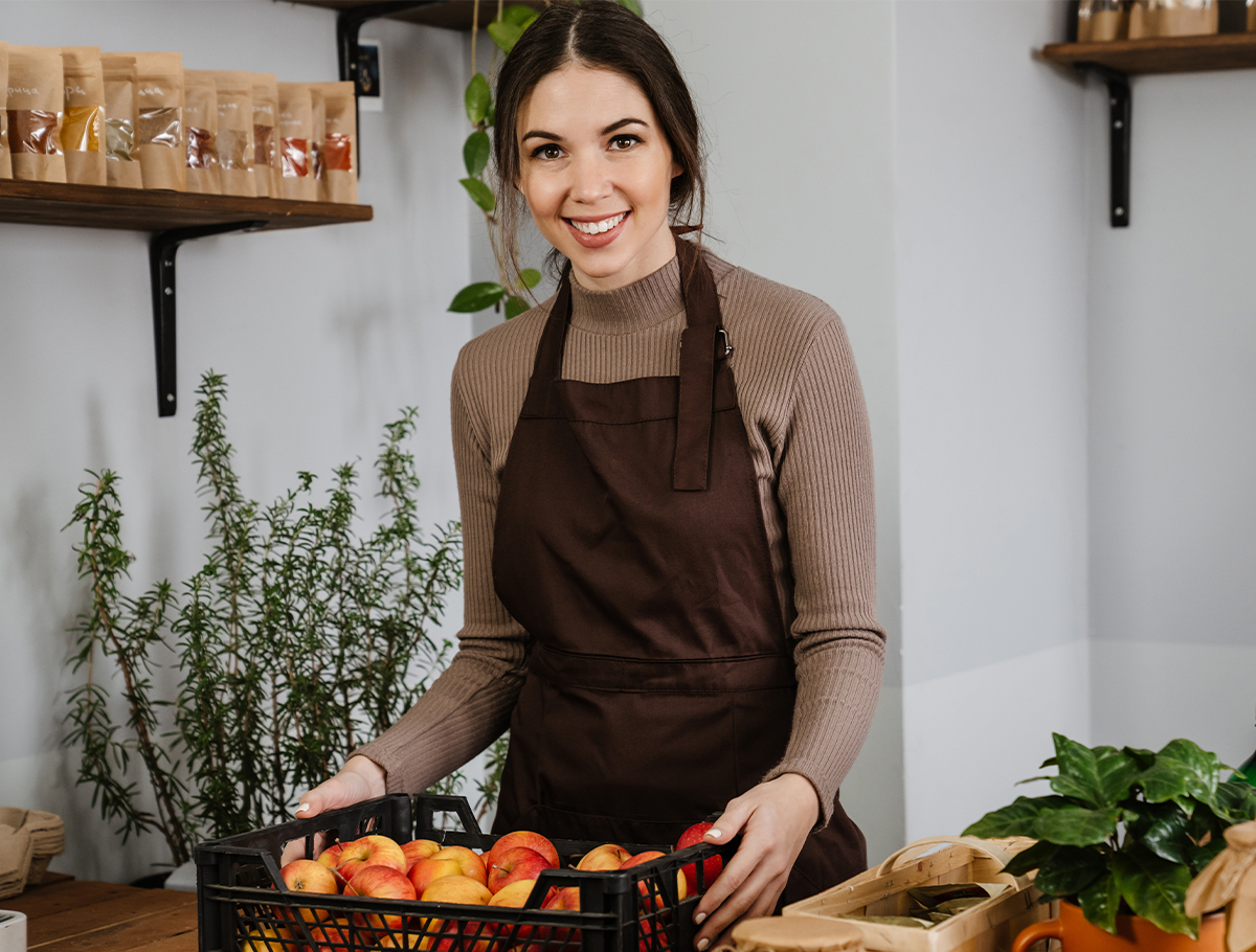 Business owner in shop smiling